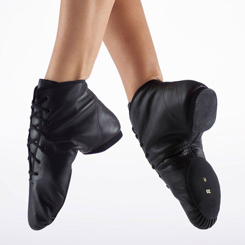 Chaussons de danse noirs souples vus de profil et par leur semelle